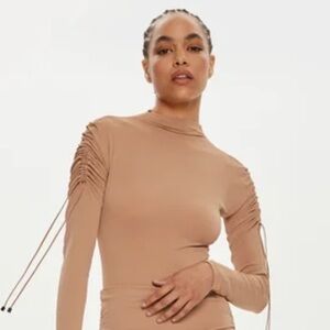 Wolford tan open back bodysuit